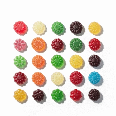 Assortment of colorful CBD gummies in various shapes and flavors