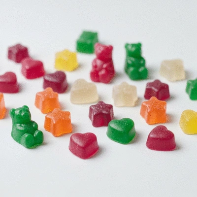 Assortment of CBD gummies in various shapes and colors