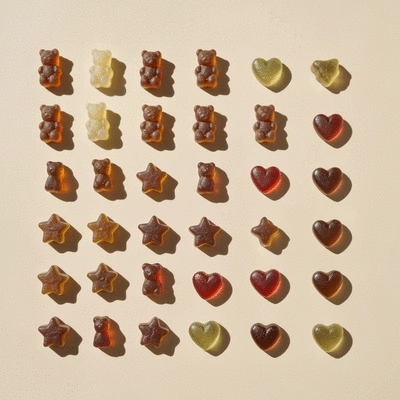 Assorted CBD gummies in various shapes and colors