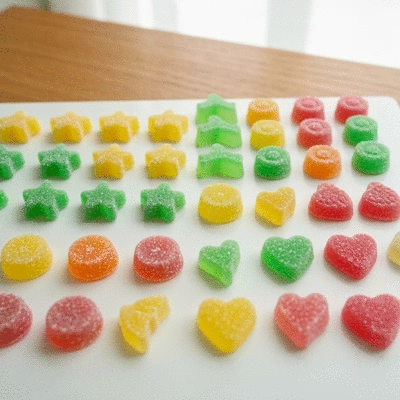 Assortment of colorful CBD gummies in different shapes and flavors